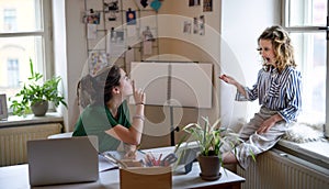 Teenager schoolgirl learning online indoors at home, coronavirus and disturbance concept.