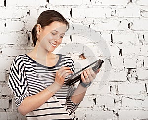 Teenager schoolgirl using tablet computer