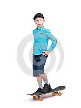 A teenager in a shirt, shorts and a baseball cap stands with his foot on a skateboard, isolated on a white background.