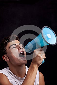 Teenager shouting with megaphone