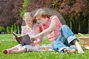 Teenager siblings reading book