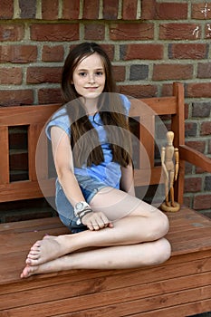 Teenager sitting on a bench