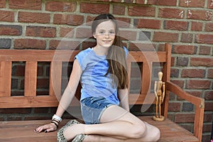 Teenager sitting on a bench