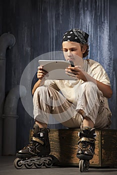 Teenager sitting with tablet pc