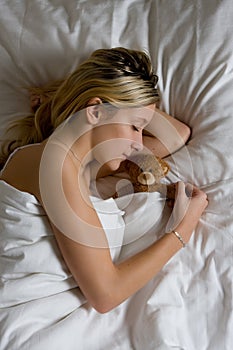 Teenager sleeping in bed