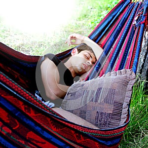 Teenager sleeping in the Hammock