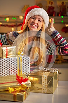 Teenager with stack of christmas present boxes