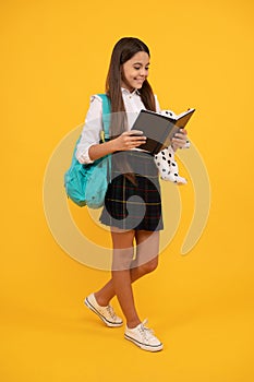 teenager student reading planner notebook. education in high school. schoolgirl