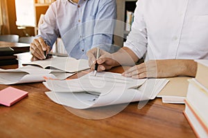 Teenager studying at desk and doing homeworks