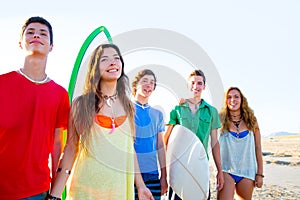 Teenager surfers boys and girls group happy