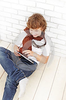 Teenager with tablet pc indoors