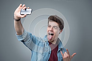 Teenager taking a funny self portrait