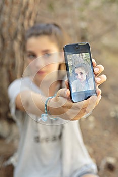 Teenager taking photos with your mobile photo