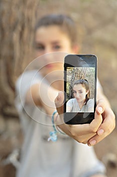 Teenager taking photos with your mobile photo