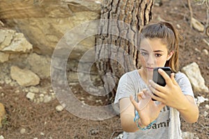 Teenager taking photos with your mobile photo