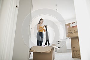 Teenager Unpacking in her New Bedroom