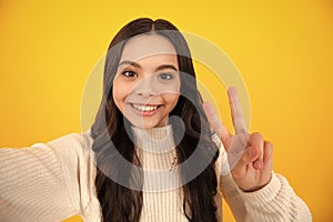 Teenager urban hipster style, lifestyle. Funny stylish young hippie teen model making selfie. Happy face, positive and