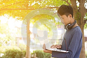 Teenager using laptop