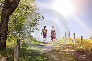 Teenager walking a path at noon