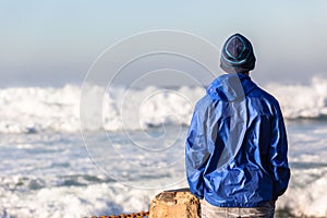 Teenager Watching Ocean Waves