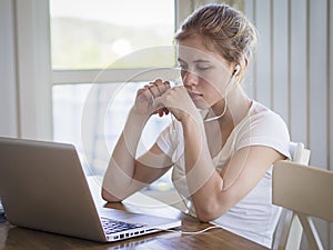 Teenager watching streamed content on pc