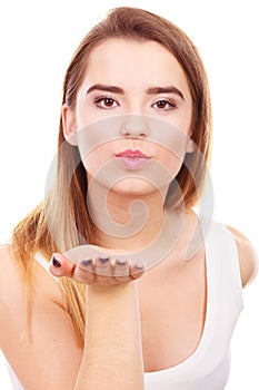 Teenager woman sending air kisses, love gesture