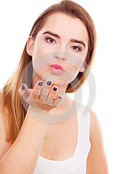 Teenager woman sending air kisses, love gesture