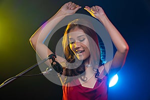 Teenager Woman sing song loudly power sound on Microphone soundproof