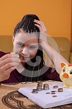 The teenager wonders how to spend the last money she has left after making all the necessary monthly payments for the
