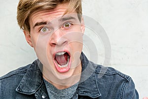 Teenager young man portrait model screaming