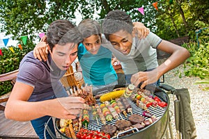 Teenagers during a barbecue at family garden BBQ