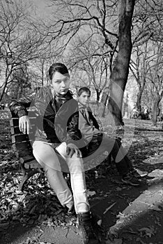 Teenagers on bench in park