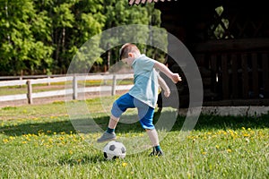 Teenagers Boys Playing Soccer Football Match. Young Football Players Running and Kicking Soccer Ball on a Soccer Pitch.