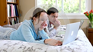 teenagers brother and sister study online at school sit in the same room together near laptop online conference look for