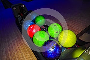 Teenagers and children play bowling throw bowling ball in Germany