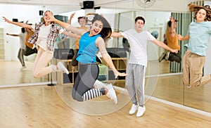 Teenagers dancers jumping in studio