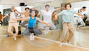 Teenagers dancers jumping in studio