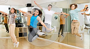 Teenagers dancers jumping in studio