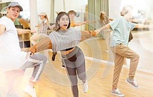 Teenagers dancing swing in studio