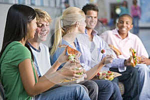 Teenagers enjoying lunch together