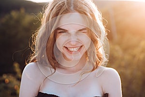 Teenagers face. Outdoor portrait of beautiful happy American girl teen female young woman smiling.