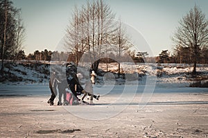 Teenagers frolic on the ice, winter fun girl skating