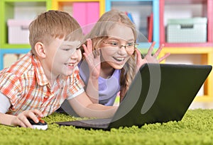 teenagers in front of modern laptop