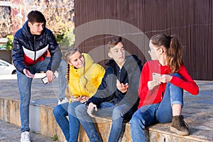 Teenagers gathering outdoors