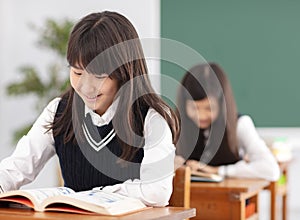 Teenagers girl student studying in classroom