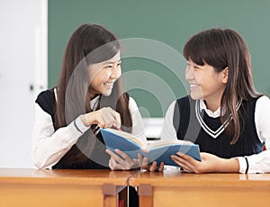 Teenagers girl student studying in classroom