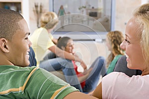 Teenagers Hanging Out In Front Of Television