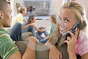 Teenagers Hanging Out In Front Of Television