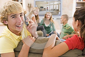 Teenagers Hanging Out In Front Of Television