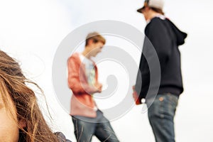 Teenagers hanging out outdoors - boys rivalry